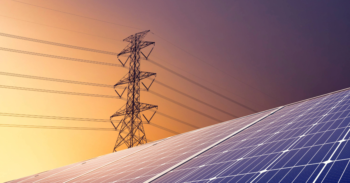 Transmission line and solar panel at sunrise