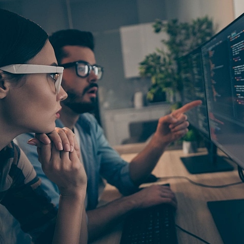 two people looking at a screen